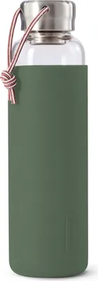 A glass water bottle with a green silicone sleeve and a rope handle.