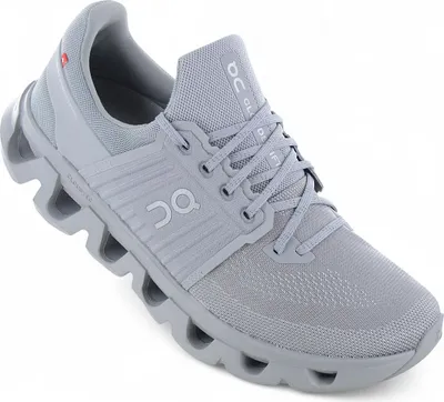A single gray running shoe is shown from a diagonal angle against a white background.
