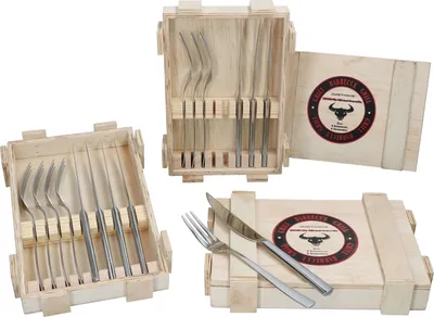 A set of BBQ steak cutlery in wooden boxes, with a logo on each box.