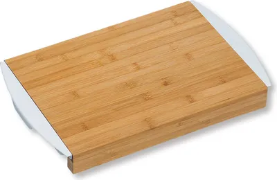 A bamboo cutting board with two white pull-out trays.