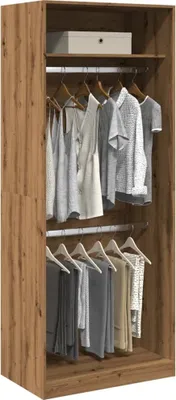 Interior view of a wooden wardrobe with clothes hanging on two levels.