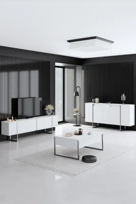 A modern living room with white furniture and black walls.