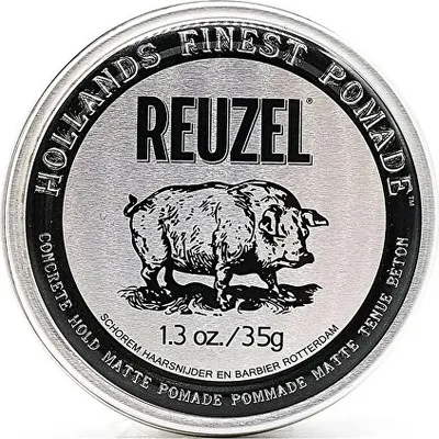 A round metal tin of Reuzel hair pomade with a pig illustration on the lid.