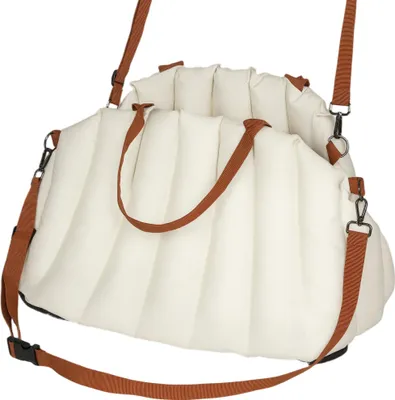 A cream-colored pet carrier bag with brown straps, shown from a slightly elevated angle against a white background.
