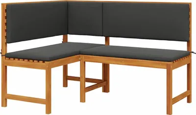 A corner garden bench with dark gray cushions, shown against a white background.