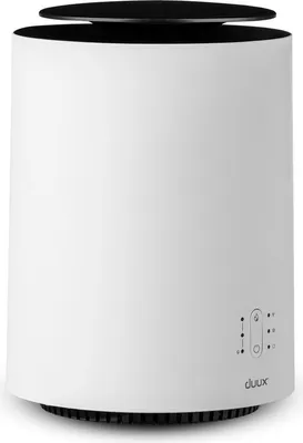 A white humidifier with a black top.