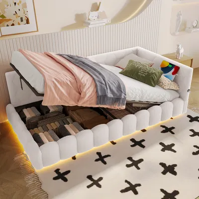 A bed with storage, featuring blankets and pillows, in a room setting.