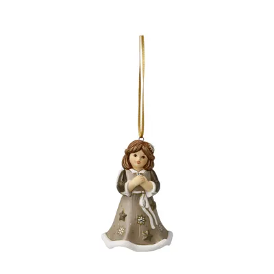 A ceramic Christmas ornament of a girl hanging from a gold ribbon.