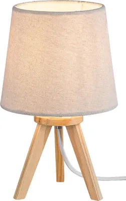 A table lamp with a fabric shade and a wooden tripod base.