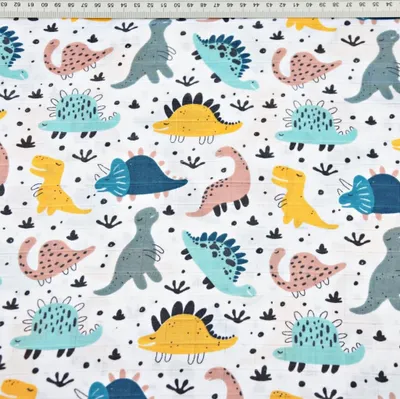 Produktbild von Baumwoll-Musselin mit bunten Dinosauriern auf weißem Hintergrund