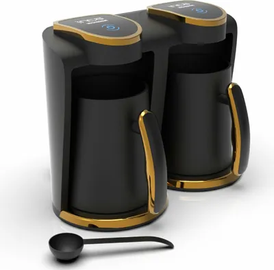 A 3D rendering of a black and gold dual coffee maker with a black scoop in front of it, set against a white background.