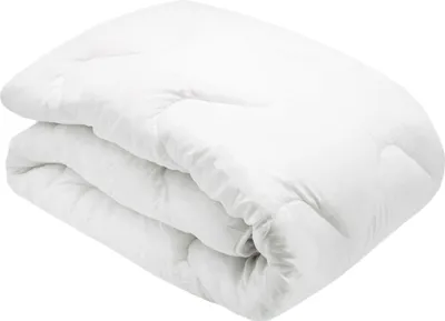 A folded white duvet on a white background.
