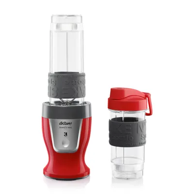 A red personal blender and a separate blending cup are displayed against a white background.
