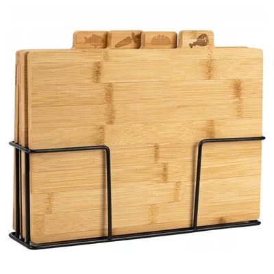 A set of four wooden cutting boards with different icons on their tabs, stored in a black metal stand.