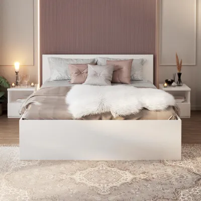 A bedroom scene with a bed, nightstands, and a rug.