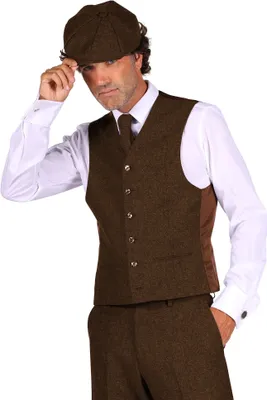 A man wearing a brown tweed vest, tie, and cap, with a white shirt, posing against a white background.