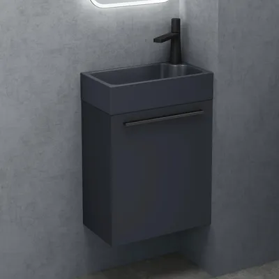 A modern, minimalist vanity set in a bathroom.