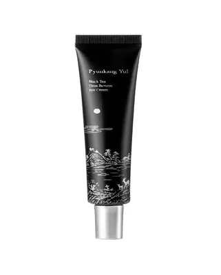 A black tube of eye cream with silver cap and black and white illustration on the tube.