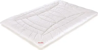 A white quilted blanket or duvet is shown lying flat on a white background.