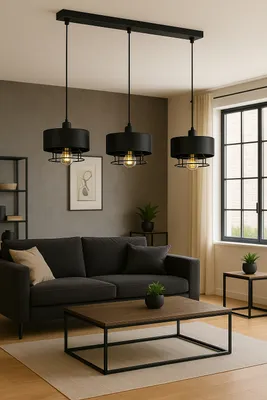 A modern living room with a dark gray sofa, coffee table, and a three-light pendant lamp.