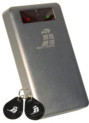 A silver external hard drive with two black RFID key fobs in front of it, set against a white background.