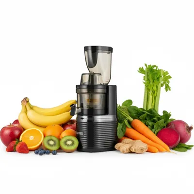 A black slow juicer is surrounded by a variety of fresh fruits and vegetables, including bananas, apples, oranges, kiwis, strawberries, blueberries, carrots, beets, ginger, spinach, and celery, against a white background.
