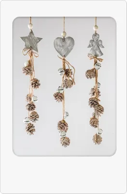 Three hanging Christmas decorations with pine cones and bells.