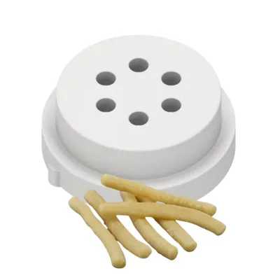 A white pasta maker disk with several small holes and a few grissini (breadsticks) in front of it.