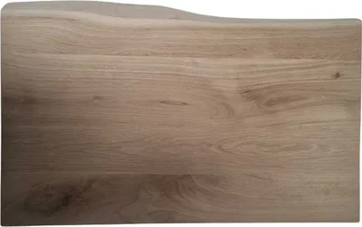 A close-up view of a wooden countertop or tabletop with a live edge.