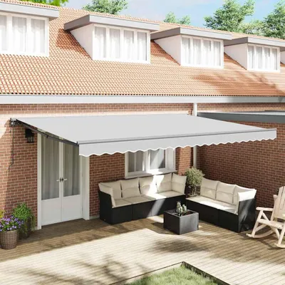 An outdoor patio with a retractable awning, seating, and a rocking chair.