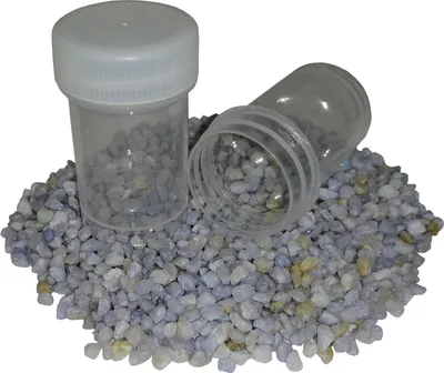 Two small clear plastic screw-top containers filled with small, light blue and white pebbles, resting on a pile of the same pebbles against a white background.