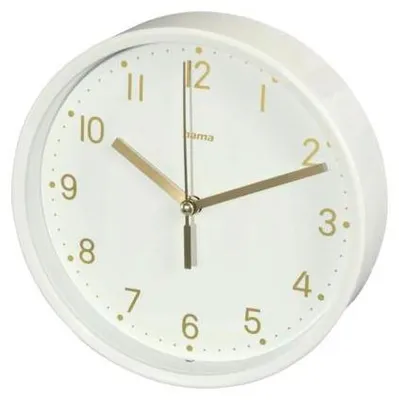 A close-up, slightly angled view of a white Hama table clock with gold hands and numerals.