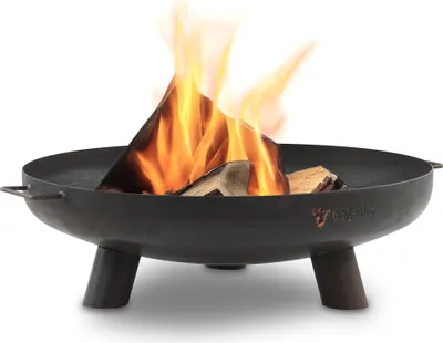 A black metal fire pit with burning logs inside, set against a white background.