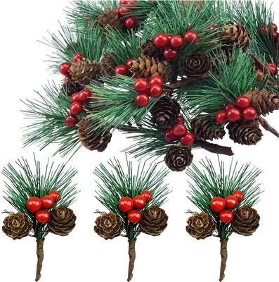 A close-up of artificial pine branches adorned with pinecones and red berries.