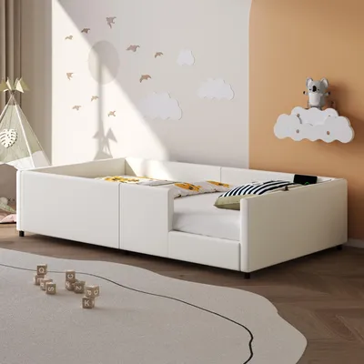A child's bedroom with a white bed, toys, and wall decorations.