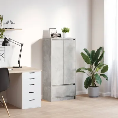 A home office setup with a desk, chair, lamp, and a cabinet.