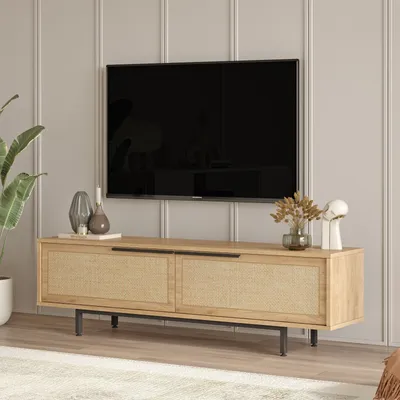 A modern living room with a TV mounted on the wall above a wooden media console.
