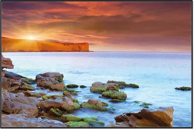 Produktbild von Wallario Wandbild Sonnenaufgang am Meer mit Landzunge und Felsen im Wasser, Größe: 61 x 91,50 cm, Poster mit schwarzem Aluminiumrahmen