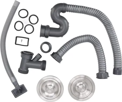 A collection of plumbing parts for a kitchen sink drain.