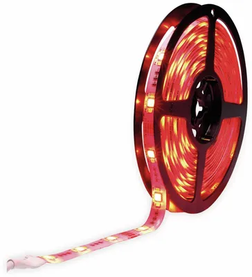 A roll of red LED strip lights on a black spool, with a section of the strip unrolled.