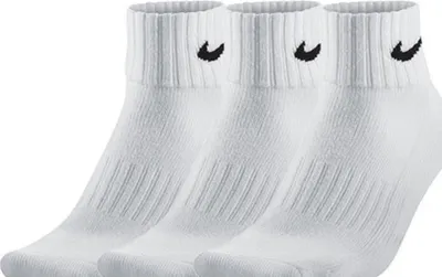 Three white Nike ankle socks are shown side-by-side against a white background.