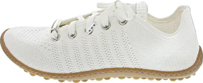 A side view of a white shoe on a white background.
