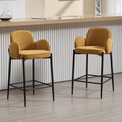 Image de Ensemble de 2 tabourets de bar, rembourrés en velours, avec accoudoirs et pieds en métal, de couleur jaune