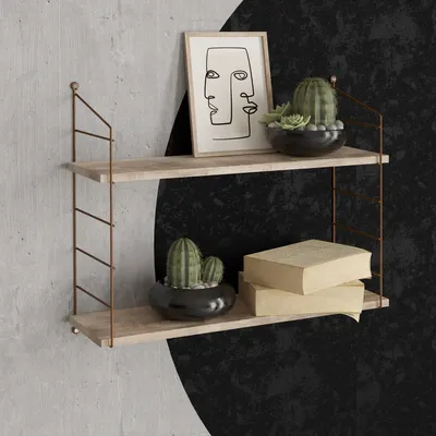 A two-tiered wall shelf with decorative items.