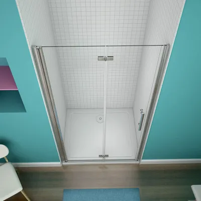 A shower enclosure with glass doors and a white shower tray, set within a bathroom with turquoise walls and white tiled ceiling.