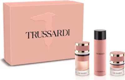 A pink gift box and three perfume bottles from the Trussardi brand are displayed against a white background.