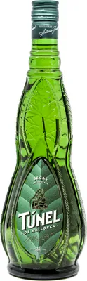 A green glass bottle of Tunel de Mallorca Hierbas Secas Dry liqueur.