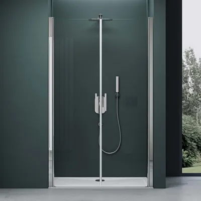 A modern shower enclosure with a sleek design, featuring a rainfall showerhead and a handheld shower wand.