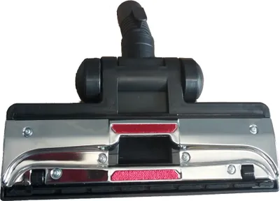 A close-up studio shot of a vacuum cleaner brush head against a white background.
