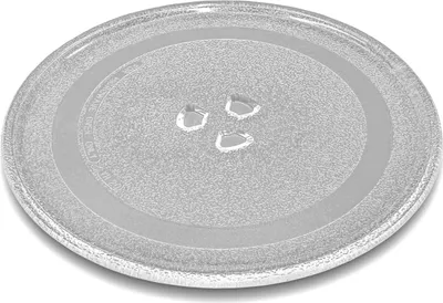 A clear, well-lit studio shot of a glass microwave turntable plate on a white background.